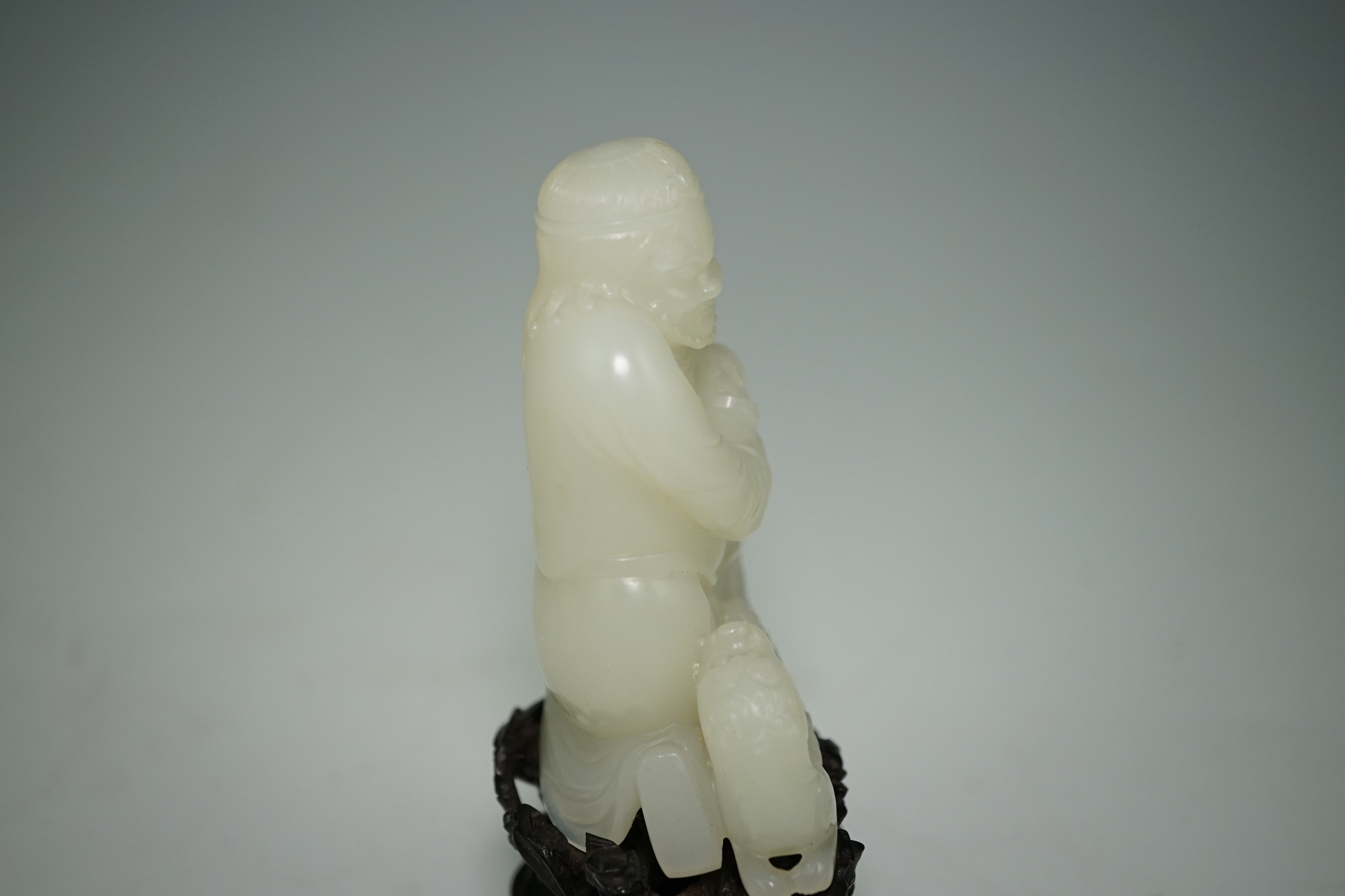 A fine Chinese white jade group of a bearded foreigner, 18th century